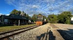 AB 1501 passes the shade drenched depot.